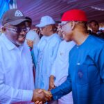 Gov Sheriff in a handshake with immediate past governor  Ifeanyi Okowa during the occasion