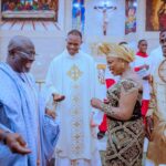 Gov Sheriff and the celebrant dancing during the Thanksgiving Service as Fr Awharemuire looks on